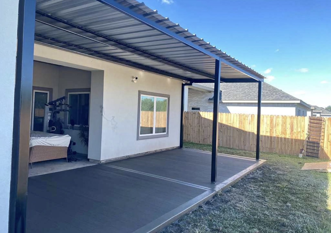 Completed metal patio cover and concrete slab built by Innova Home Construction